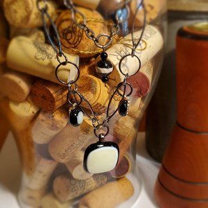 Multi strand metal chained necklace with bead pendants